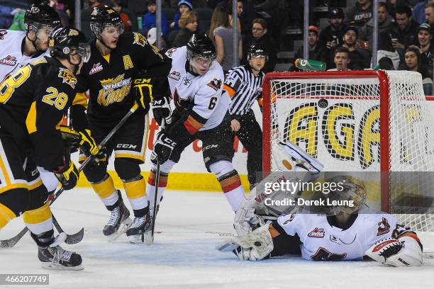 Quintin Lisoway of the Brandon Wheat Kings scores against Chris Driedger of the Calgary Hitmen during a WHL game at Scotiabank Saddledome on January...