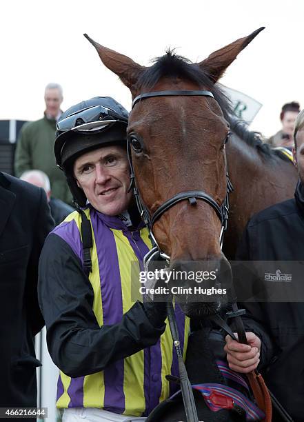 Tony McCoy riding Definite Outcome celebrates after winning the Betfred "Like us on Facebook" Standard Open National Hunt Flat Race at Uttoxeter...