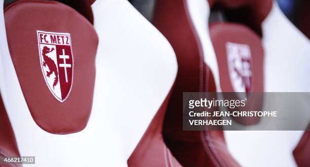 Metz' logo is pictured on the team's bench during the French L1 football match between Metz and Saint-Etienne on March 14, 2015 at Saint Symphorien...