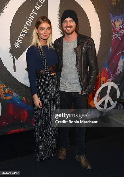 Lauren Parsekian and Aaron Paul attend the ESPN The Party at Basketball City - Pier 36 - South Street on January 31st, 2014 in New York City