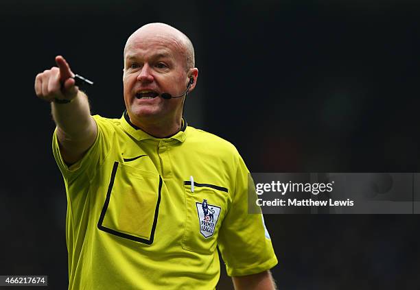 Referee Lee Mason makes his point during the Barclays Premier League match between Crystal Palace and Queens Park Rangers at Selhurst Park on March...