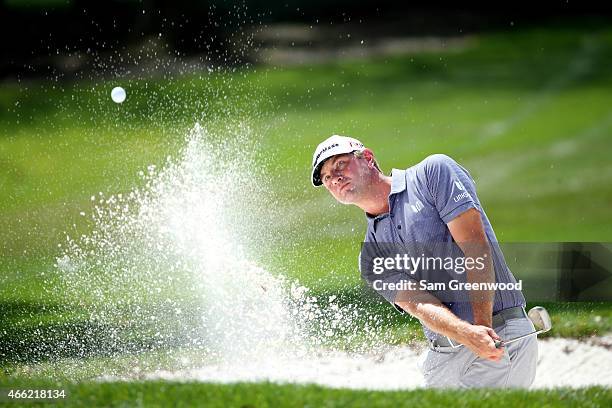 Lucas Glover hits out of a bunker on the first hole during the third round of the Valspar Championship at Innisbrook Resort Copperhead Course on...