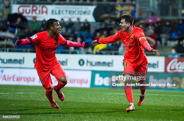 Lionel Messi of FC Barcelona celebrates with his teammate Rafinha of FC Barcelona after scoring his goal during the La Liga match between SD Eibar...