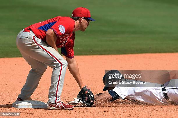 Anthony Gose of the Detroit Tigers is tagged out at second base by Cord Phelps of the Philadelphia Phillies during the sixth inning of a spring...