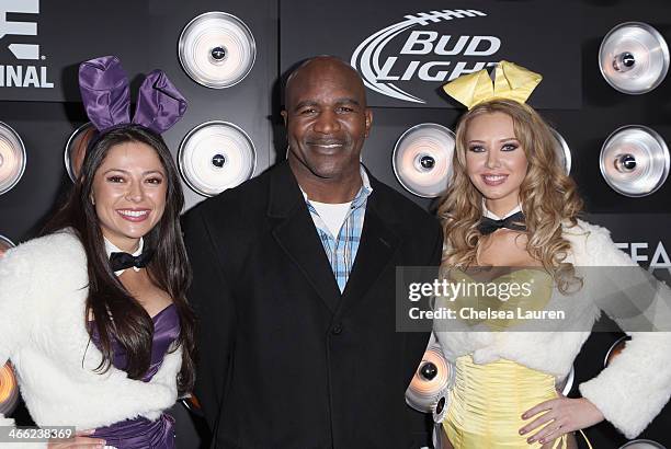 Playboy Playmate Miss August 2004 Pilar Lastra, professional boxer Evander Holyfield, and Playboy Playmate Miss September 2011 Tiffany Toth attend...