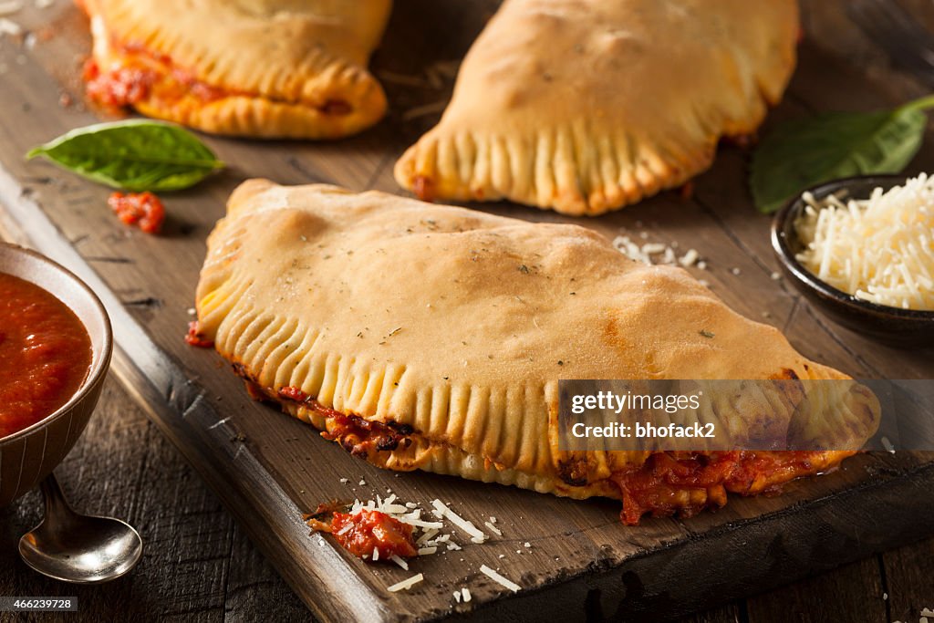 Close-up of Italian meat and cheese calzone