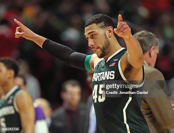 Denzel Valentine of the Michigan State Spartans celebrates a win over the Maryland Terrapins during the semifinal round of the 2015 Big Ten Men's...