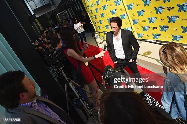 Co-director Adrien Brody is interviewed before the "Stone Barn Castle" premiere during the 2015 SXSW Music, Film + Interactive Festival at Topfer...