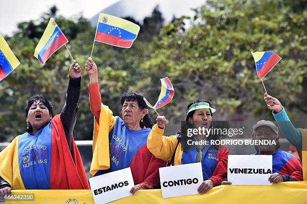 Sympathizers of Venezuela shout slogans outside the UNASUR headquarters where a meeting is being held, in Quito, on March 14, 2015. Ecuador called...