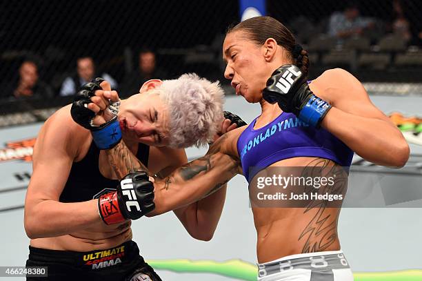 Germaine de Randamie lands a punch to the chin of Larissa Pacheco in their women's bantamweight bout during the UFC 185 event at the American...