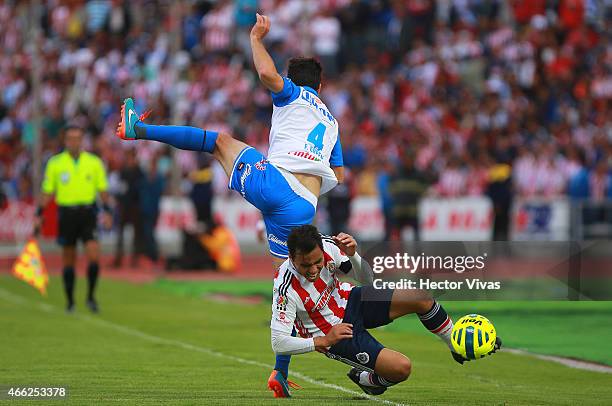 Omar Bravo of Chivas struggles for the ball with Facundo Erpen of Puebla during a match between Puebla and Chivas as part of 10th round Clausura 2015...