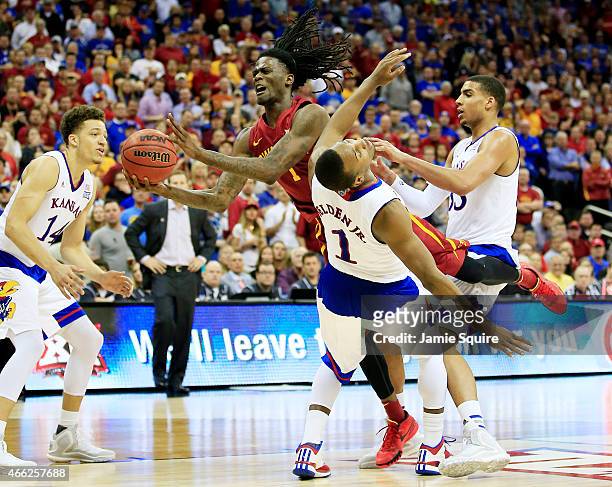 Jameel McKay of the Iowa State Cyclones goes up against Wayne Selden Jr. #1 of the Kansas Jayhawks in the second half during the championship game of...