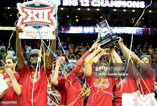 The Iowa State Cyclones celebrate with the trophy after their 70 to 66 win over the Kansas Jayhawks during the championship game of the Big 12...