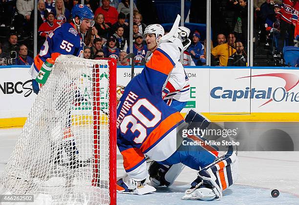 Michal Neuvirth of the New York Islanders allows a short-handed goal by Max Pacioretty of the Montreal Canadiens in the second period at Nassau...