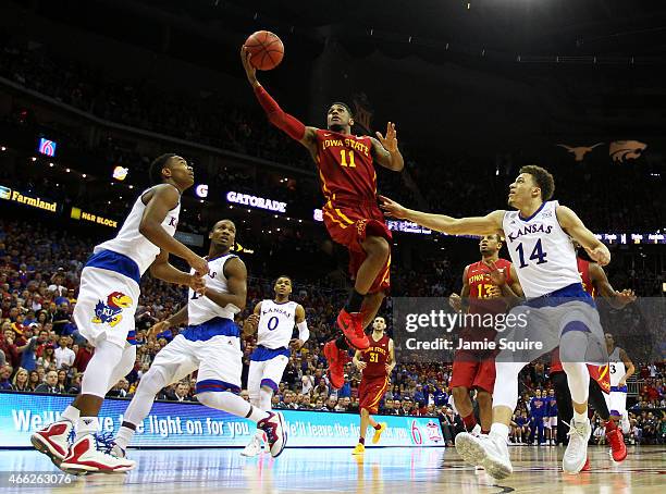 Monte Morris of the Iowa State Cyclones goes up against the Kansas Jayhawks in the second half during the championship game of the Big 12 Basketball...