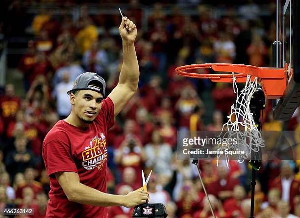 Naz Long of the Iowa State Cyclones cuts down a piece of the net after their 70 to 66 victory over the Kansas Jayhawks during the championship game...