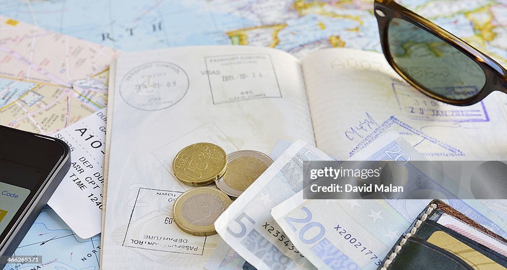 Passport, maps, money, boarding pass etc