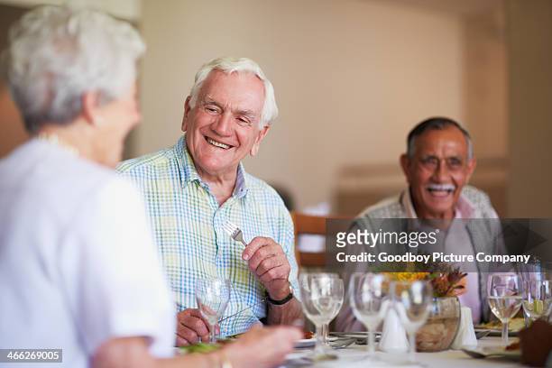 enjoying an excellent lunch - senior lunch stock pictures, royalty-free photos & images