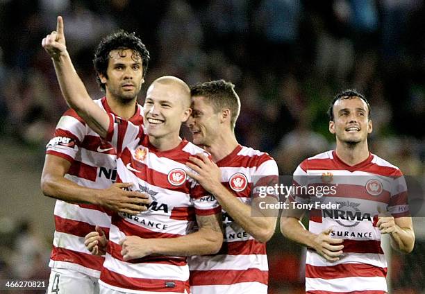 Western Sydney Wanderers team mates celebrate a goal during the round 17 A-League match between Newcastle Jets and the Western Sydney Wanderers at...