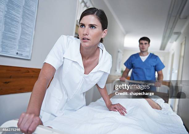 getting the patient to the operating room - pushing stretcher stock pictures, royalty-free photos & images