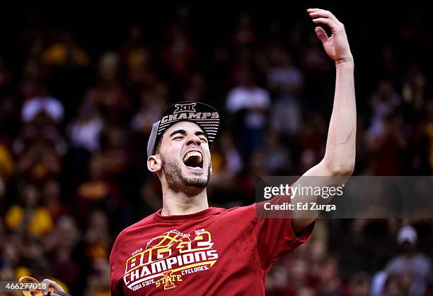 Most outstanding player Georges Niang of the Iowa State Cyclones cuts down a piece of the net after their 70 to 66 victory over the Kansas Jayhawks...