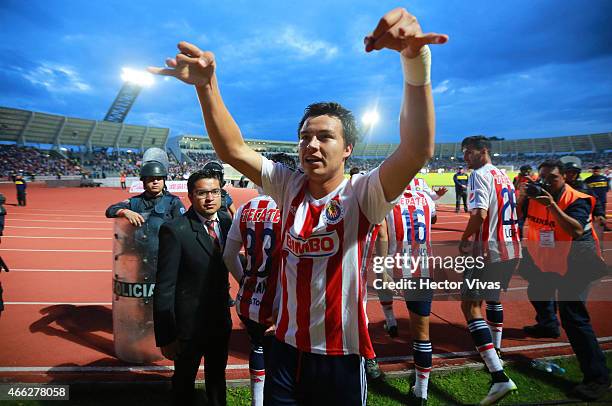 Erick Torres of Chivas celebrates with teammates after scoring the second goal of his team during a match between Puebla and Chivas as part of 10th...