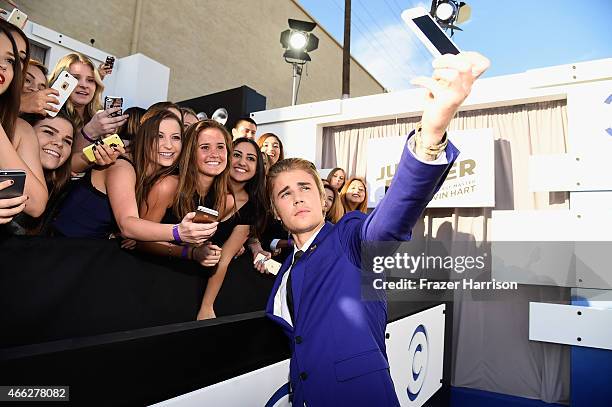 Honoree Justin Bieber takes a selfie with fans at The Comedy Central Roast of Justin Bieber at Sony Pictures Studios on March 14, 2015 in Los...