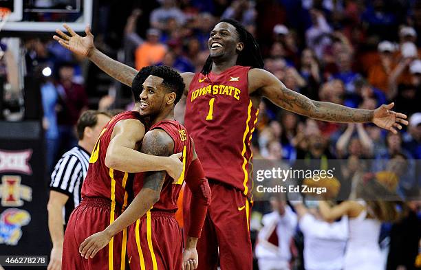 Jameel McKay, Monte Morris and Dustin Hogue of the Iowa State Cyclones celebrate their 70 to 66 win over the Kansas Jayhawks during the championship...