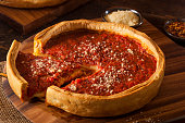 Deep dish pizza with lots of sauce