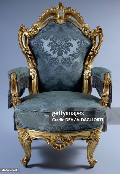 Neo-Baroque style carved and gilt wood armchair, by Giovanni Moscotto, ca 1850. Italy, 19th century.