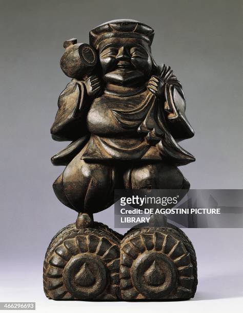 Statuette of Daikoku, god of wealth, 18th century, wood, height 34 cm. Japanese civilisation, Edo period, 17th-19th century.