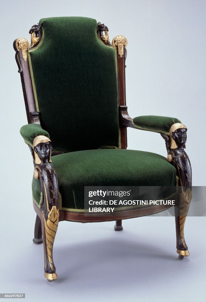 Egyptian style ebonized armchair