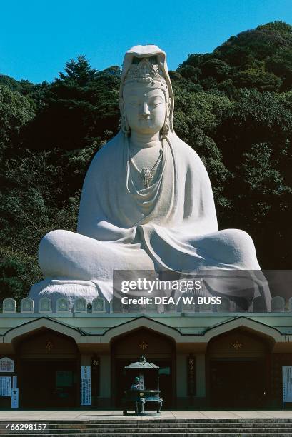 The concrete and stone statue of Bodhisattva Avalokitesvara that surmounts the Ryozen Kannon Temple, Kyoto, Kansai, Japan, 20th century.
