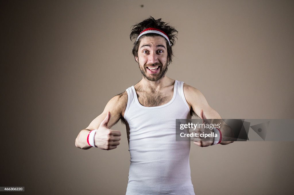 Funny sports nerd posing with thumbs up