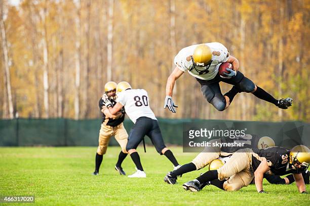 american football players in action. - touchdown stock pictures, royalty-free photos & images