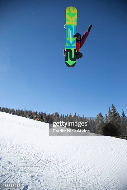 Snowboarder Ben Kilner of Team GB doing a huge frontside grab in the half pipe at Copper mountain on December 20, 2012 in Colorado.