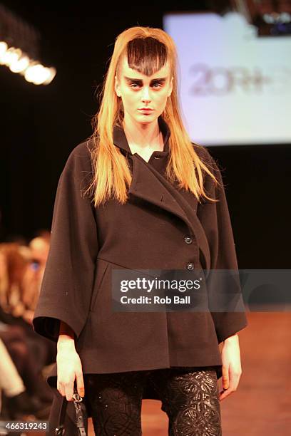 Model walks the runway at the 2OR+BYYAT show during Copenhagen Fashion Week AW14 on January 31, 2014 in Copenhagen, Denmark.