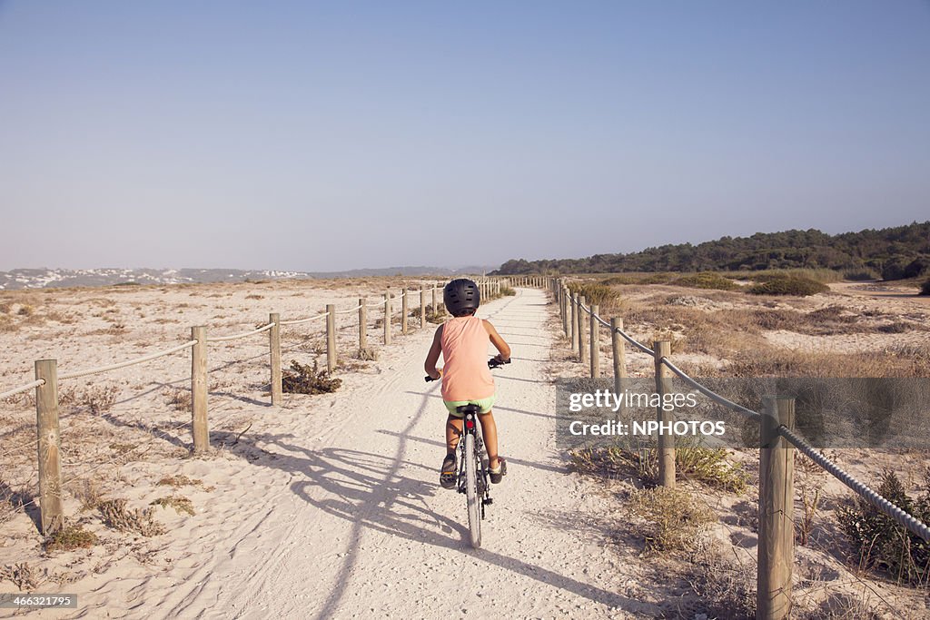 Kid riding her bicycle
