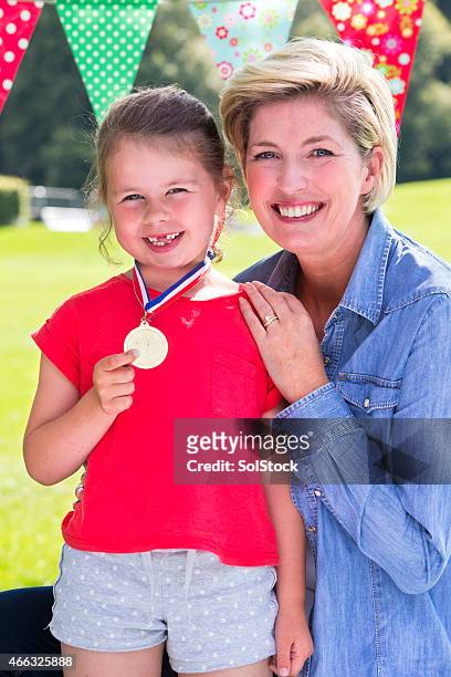 mother with daughter at her sports day - cas awards stock pictures, royalty-free photos & images