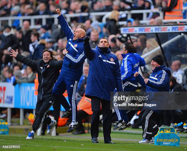 Gus Poyet the Sunderland manager and his coaching staff celebrate their team's third goal during the Barclays Premier League match between Newcastle...