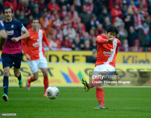 Joo-Ho Park of Mainz is socring his teams opening goal during the Bundesliga match between FSV Mainz 05 and SC Freiburg at Coface Arena on February...