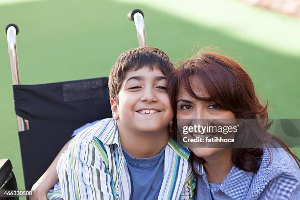 little boy and mother - of children with cerebral palsy stock pictures, royalty-free photos & images