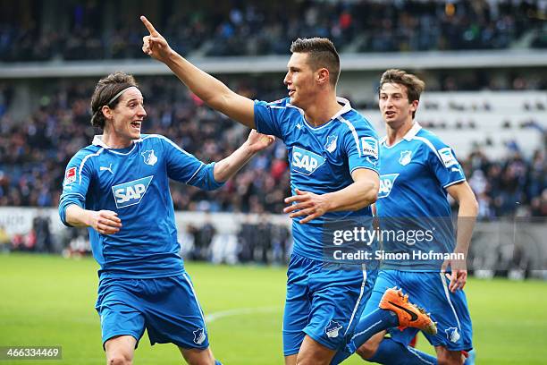 Niklas Suele of Hoffenheim celebrates his team's second goal with his team mate Sebastian Rudy of Hoffenheim during the Bundesliga match between 1899...