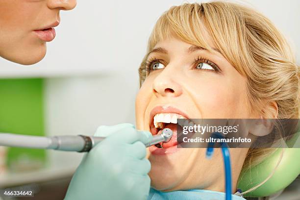dentistry dentist working dental drill - dental drill stock pictures, royalty-free photos & images