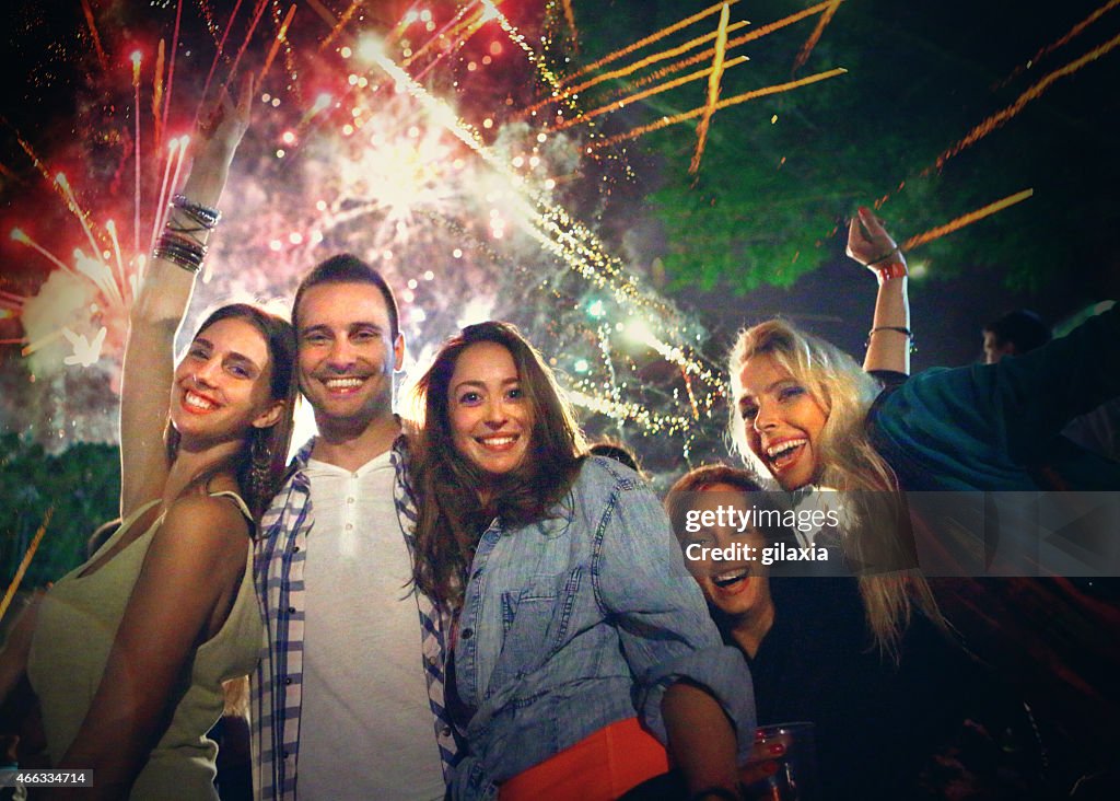 People celebrating with fireworks.