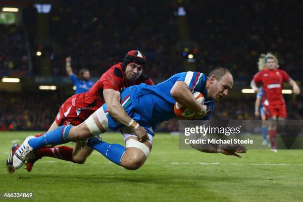 Sergio Parisse of Italy crosses the try line as Leigh Halfpenny of Wales challenges only for the try to be disallowed during the RBS Six Nations...