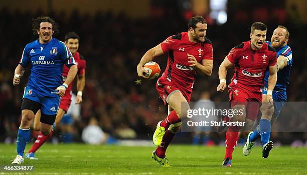 Wales player Jamie Roberts makes a break before setting up Scott Williams for the second Wales try during the RBS Six Nations match between Wales and...