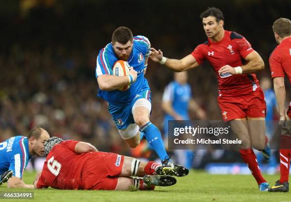 Michele Rizzo Rugby Michele Rizzo of Italy surges past Mike Phillips of Wales during the ...