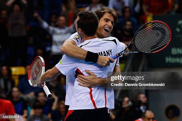 Philipp Kohlschreiber and Tommy Haas of Germany celebrate after winning their double match against Fernando Verdasco and David Marrero of Spain on...