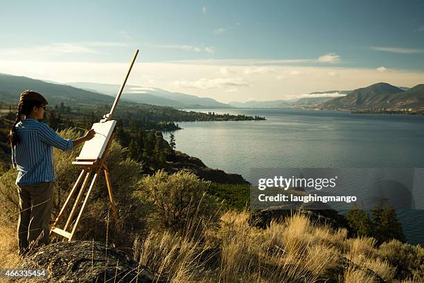 woman artist oil painting vineyard - penticton stockfoto's en -beelden